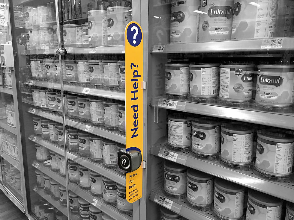 Figure 1. Retail help button mounted to the store shelving.