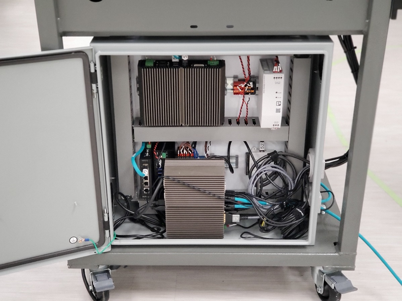 Rugged industrial computers handle all computation in this machine including the Universal Robot Arm, Canon EOS 5D Mark IV, operator interface, and 3 levels of LabVIEW parallel-loop sequencers.