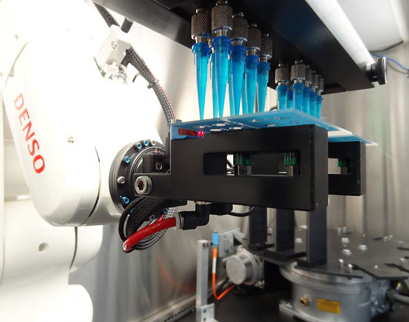 Automated dispenser fills test slides with liquid viral contents